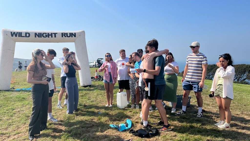 Festival atmosphere with runners, campers and families enjoying Something Wild Festival.
