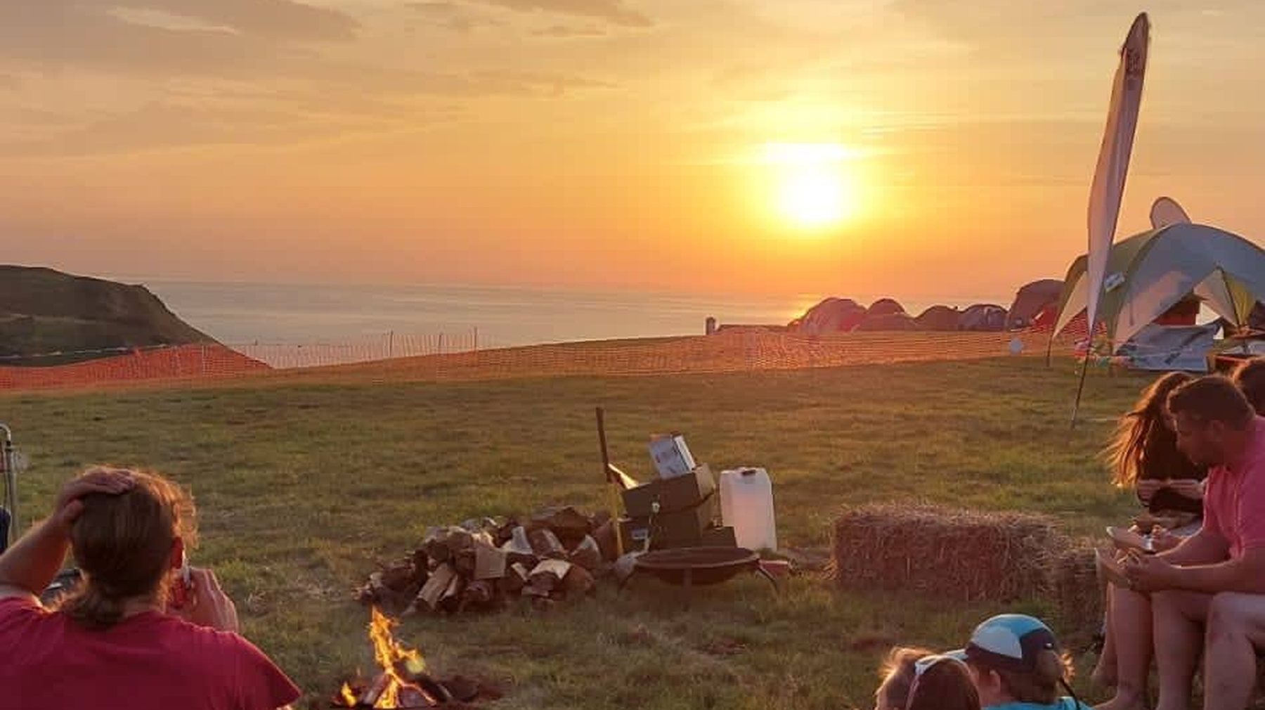 Sunset over the Something Wild Festival campsite at Hope Cove, Devon.